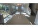 Open concept living room with plenty of windows and a staircase to the second floor at 116 Arundel Dr, Archer Lodge, NC 27527