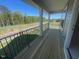 Relax on the spacious balcony offering serene views of the surrounding landscape at 118 Arundel Dr, Archer Lodge, NC 27527