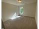 Cozy bedroom with plush carpeting and lots of natural light at 118 Arundel Dr, Archer Lodge, NC 27527
