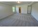 Large carpeted main bedroom with a window and an open view into the ensuite bathroom at 118 Arundel Dr, Archer Lodge, NC 27527