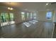 Spacious living room with sliding glass doors to the deck, recessed lighting, ceiling fan, and gray vinyl floors at 118 Arundel Dr, Archer Lodge, NC 27527