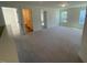 Spacious carpeted loft area leading to multiple doorways and windows at 118 Arundel Dr, Archer Lodge, NC 27527