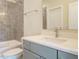Bathroom featuring a shower/tub combination, modern fixtures, and a stylish vanity at 1233 Azalea Garden Cir, Raleigh, NC 27603