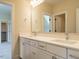 Well-lit bathroom featuring double sink vanity with white cabinets and modern fixtures at 1233 Azalea Garden Cir, Raleigh, NC 27603
