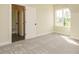 Bright bedroom with carpeted floors, closet and a large window at 1233 Azalea Garden Cir, Raleigh, NC 27603