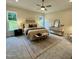 Serene bedroom with carpet, two windows, a ceiling fan, and a neutral color palette at 1233 Azalea Garden Cir, Raleigh, NC 27603