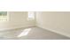 Bright bedroom with neutral walls, carpeted floor and white trim throughout at 1233 Azalea Garden Cir, Raleigh, NC 27603