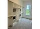 Large, organized closet with shelving and ample hanging space and a view to the lush outdoors at 1233 Azalea Garden Cir, Raleigh, NC 27603