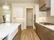 Stylish kitchen with a farmhouse sink, gas range, and custom cabinetry at 1233 Azalea Garden Cir, Raleigh, NC 27603