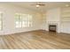 Spacious living room with fireplace, built-in shelves, and hardwood floors at 1233 Azalea Garden Cir, Raleigh, NC 27603
