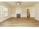 Well-lit living room with modern fireplace and built-in storage at 1233 Azalea Garden Cir, Raleigh, NC 27603