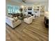 Expansive living room featuring a fireplace, built-in bookshelves, and natural light from multiple windows at 1233 Azalea Garden Cir, Raleigh, NC 27603