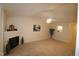 Open living room with fireplace and neutral decor at 2410 Huntscroft Ln # 203, Raleigh, NC 27617