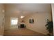 Bright living room with vaulted ceiling and ceiling fan at 2410 Huntscroft Ln # 203, Raleigh, NC 27617