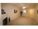 Spacious living room featuring a fireplace and vaulted ceiling at 2410 Huntscroft Ln # 203, Raleigh, NC 27617