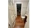 Updated bathroom with linen closet and wood-look flooring at 31 Strickland Rd, Smithfield, NC 27577