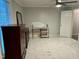 Spacious bedroom with wood dresser, ceiling fan, and tile floors at 31 Strickland Rd, Smithfield, NC 27577
