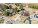 Aerial view showcasing several homes with extended driveways, mature trees, and proximity to roadways at 5093 Nc 56 Hwy, Franklinton, NC 27525