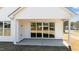 Covered patio with sliding glass doors leading to the backyard at 5093 Nc 56 Hwy, Franklinton, NC 27525