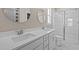 Modern bathroom featuring a double sink vanity, quartz counters and glass-enclosed shower at 5093 Nc 56 Hwy, Franklinton, NC 27525