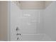Clean, functional bathtub and shower with chrome fixtures in a neutral-toned bathroom at 5093 Nc 56 Hwy, Franklinton, NC 27525