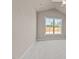 Cozy bedroom with a large window providing natural light and a peaceful view at 5093 Nc 56 Hwy, Franklinton, NC 27525