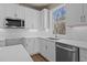 Bright kitchen featuring stainless steel appliances, a white countertop, and white cabinets at 5093 Nc 56 Hwy, Franklinton, NC 27525
