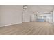 Bright, open-concept living area featuring sleek wood floors and elegant light fixtures at 5093 Nc 56 Hwy, Franklinton, NC 27525