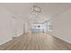 Bright, open-concept living area featuring sleek wood floors and elegant light fixtures at 5093 Nc 56 Hwy, Franklinton, NC 27525