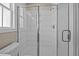 Glass enclosed shower with modern vertical subway tile and chrome fixtures at 5093 Nc 56 Hwy, Franklinton, NC 27525