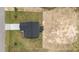 Aerial view of the new construction home shows the roofline and surrounding yard at 55 Diamond Creek Dr, Zebulon, NC 27597