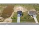 Aerial shot of new home construction with landscaping and a long driveway at 55 Diamond Creek Dr, Zebulon, NC 27597