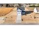 Aerial view of a home and its surroundings, showcasing a spacious lot, concrete driveway and modern design at 55 Diamond Creek Dr, Zebulon, NC 27597
