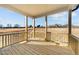 View of the home's wood plank back porch, offering serene views of the adjacent landscape at 55 Diamond Creek Dr, Zebulon, NC 27597