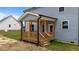New construction home has a covered back porch with wood columns and railings at 55 Diamond Creek Dr, Zebulon, NC 27597