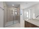 Bright bathroom with a glass-enclosed shower, tiled walls, and modern fixtures at 55 Diamond Creek Dr, Zebulon, NC 27597