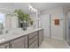 Modern bathroom features double sink vanity and large decorative greenery at 55 Diamond Creek Dr, Zebulon, NC 27597