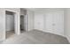 Bedroom with plush carpeting, three closets, and neutral walls and trim at 55 Diamond Creek Dr, Zebulon, NC 27597