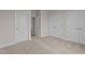 Bedroom featuring neutral carpet and paint with multiple closets at 55 Diamond Creek Dr, Zebulon, NC 27597