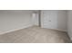 Bedroom with neutral carpet, double door closet, and fresh paint at 55 Diamond Creek Dr, Zebulon, NC 27597