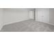 Cozy bedroom with neutral carpet, fresh paint, a double door closet, and white trim at 55 Diamond Creek Dr, Zebulon, NC 27597