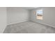 Bedroom featuring neutral carpeting, a window, and fresh paint at 55 Diamond Creek Dr, Zebulon, NC 27597