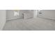 Spacious bedroom featuring neutral carpet and base trim, with natural light from two windows at 55 Diamond Creek Dr, Zebulon, NC 27597