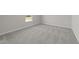Bedroom featuring neutral carpeting, a window, and fresh paint at 55 Diamond Creek Dr, Zebulon, NC 27597