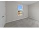 Bedroom with carpet and a window overlooking a field, complemented by neutral walls at 55 Diamond Creek Dr, Zebulon, NC 27597