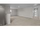 Spacious bonus room with neutral carpet and ample natural light from a large window at 55 Diamond Creek Dr, Zebulon, NC 27597
