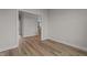Open hallway with wood-look flooring at 55 Diamond Creek Dr, Zebulon, NC 27597