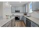 Modern kitchen featuring stainless steel appliances, stylish countertops, and ample cabinet space at 55 Diamond Creek Dr, Zebulon, NC 27597