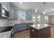 Well-lit kitchen showcasing a center island, stainless steel appliances, and stylish backsplash at 55 Diamond Creek Dr, Zebulon, NC 27597