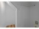 Bright laundry area features white walls, utility connections, and a storage shelf at 55 Diamond Creek Dr, Zebulon, NC 27597